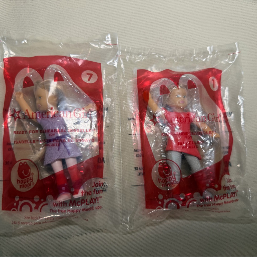 American Girl Mini Dolls with Pink and Purple Outfits